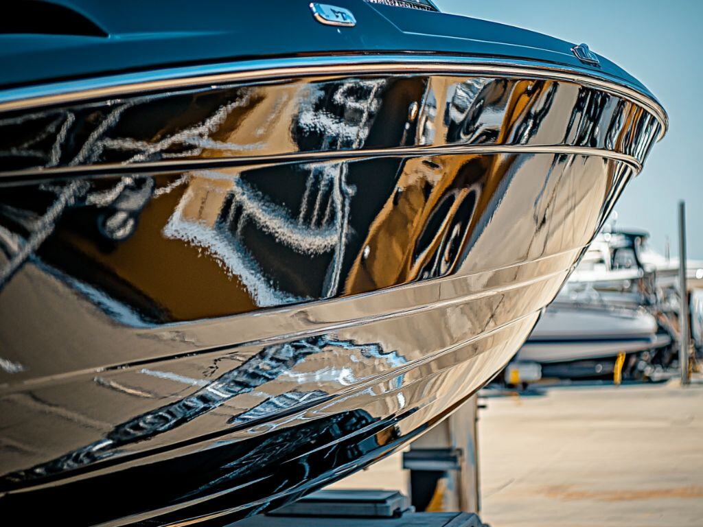 Close-up of a boat showcasing the reflective finish of a ceramic coating application.