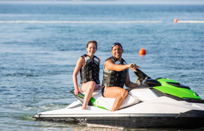 couple riding on a jet ski