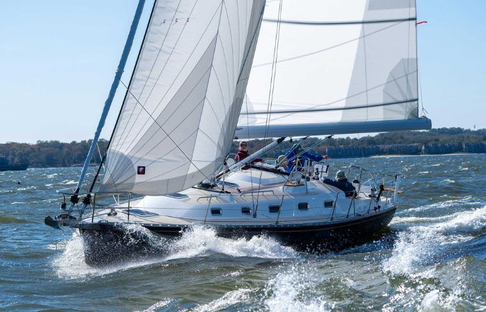 family sailing on a sailboat