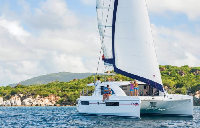 family sitting on a catamaran