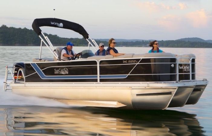 people riding in a pontoon boat